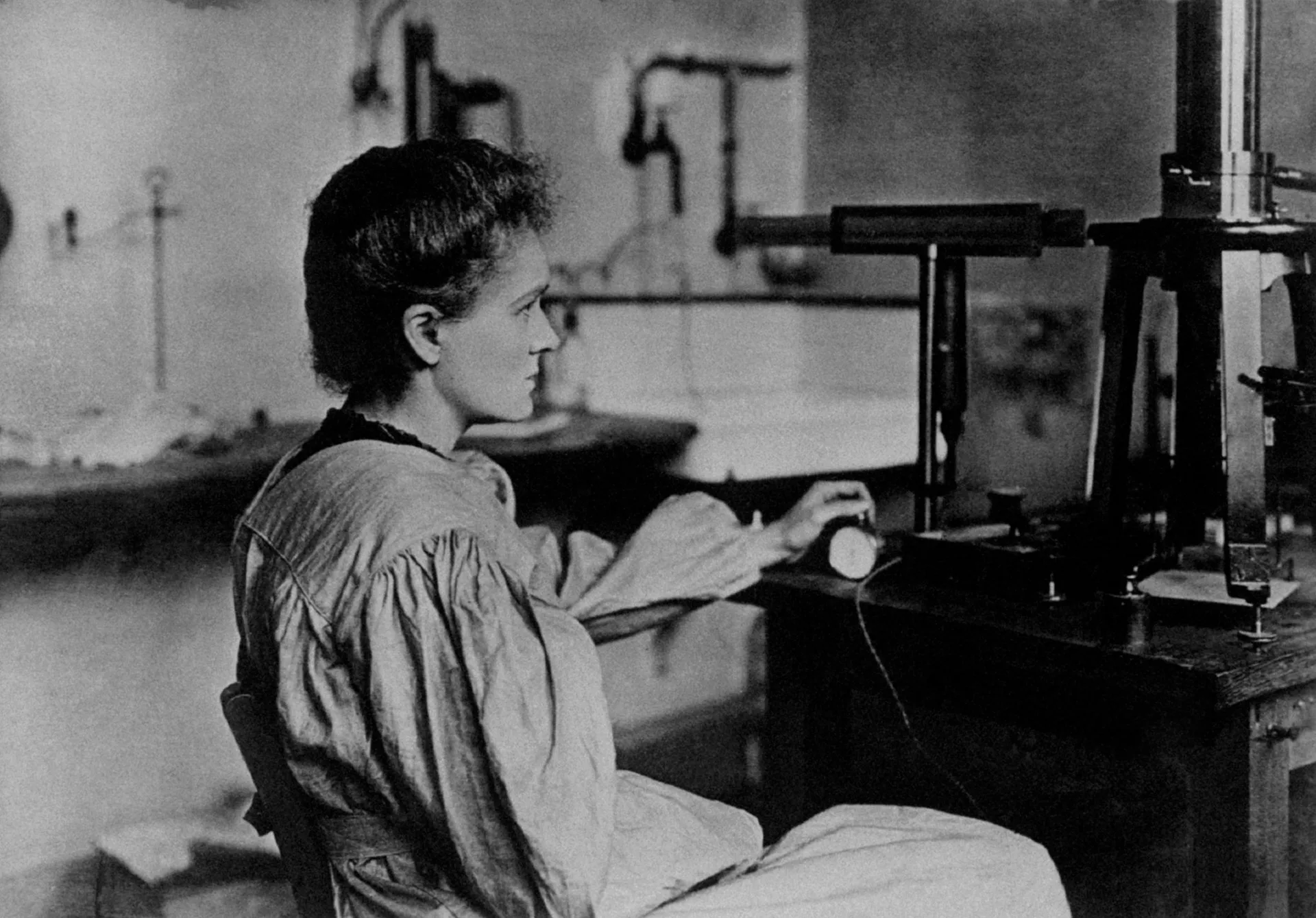 Marie Curie working in her laboratory, where she handled radioactive materials without protection
